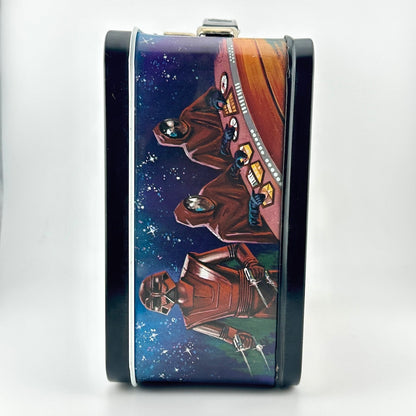 A rectangular metal lunchbox with a dark blue and brown sci-fi space illustration, shown on a white background.