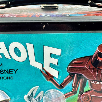Close-up of a rectangular metal lunch box featuring a colorful robot sci-fi scene. 