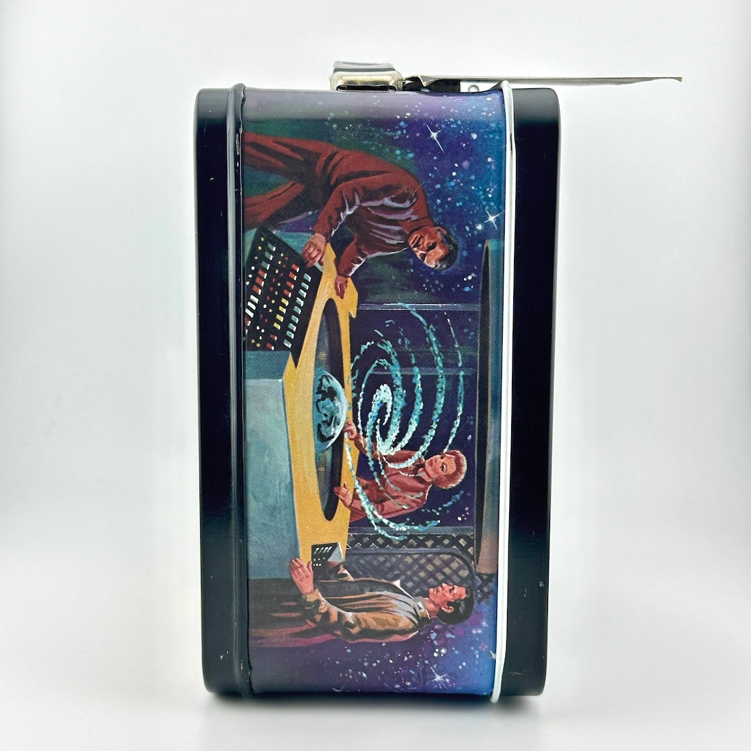 A rectangular metal lunchbox featuring a printed sci-fi illustration of a warp drive and figures in space.