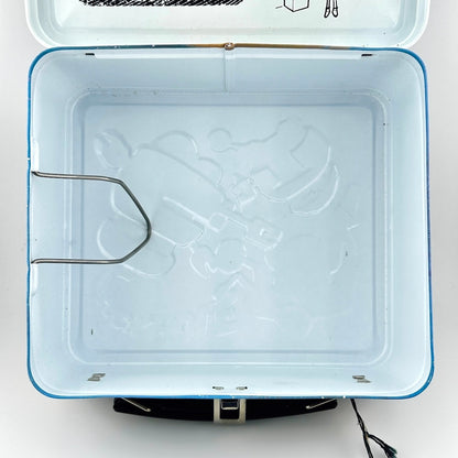 Top-down view of interior of metal lunchbox, showing white interior with no rust or wear. 