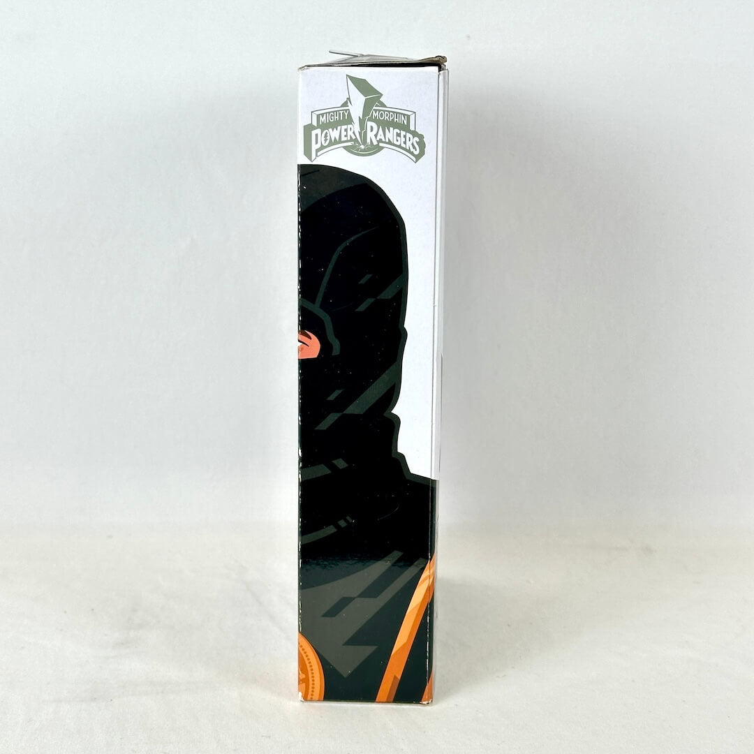 Side view of packaging with illustration of Black Ranger under the Power Rangers logo. 