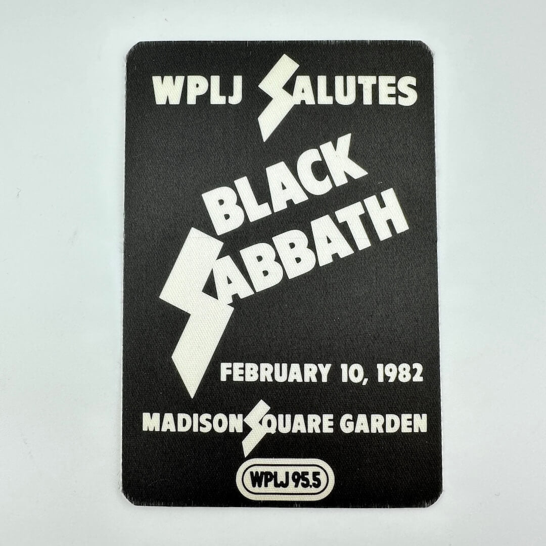 Black and white fabric event pass for Black Sabbath against white background. 