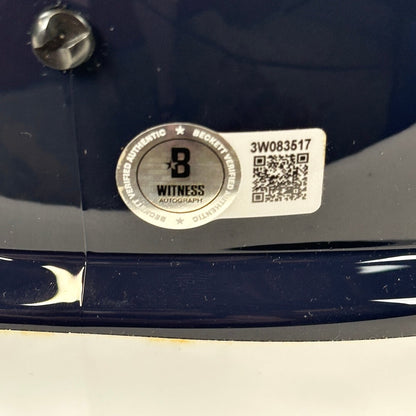 Close-up of authentication sticker with QR code and number. 