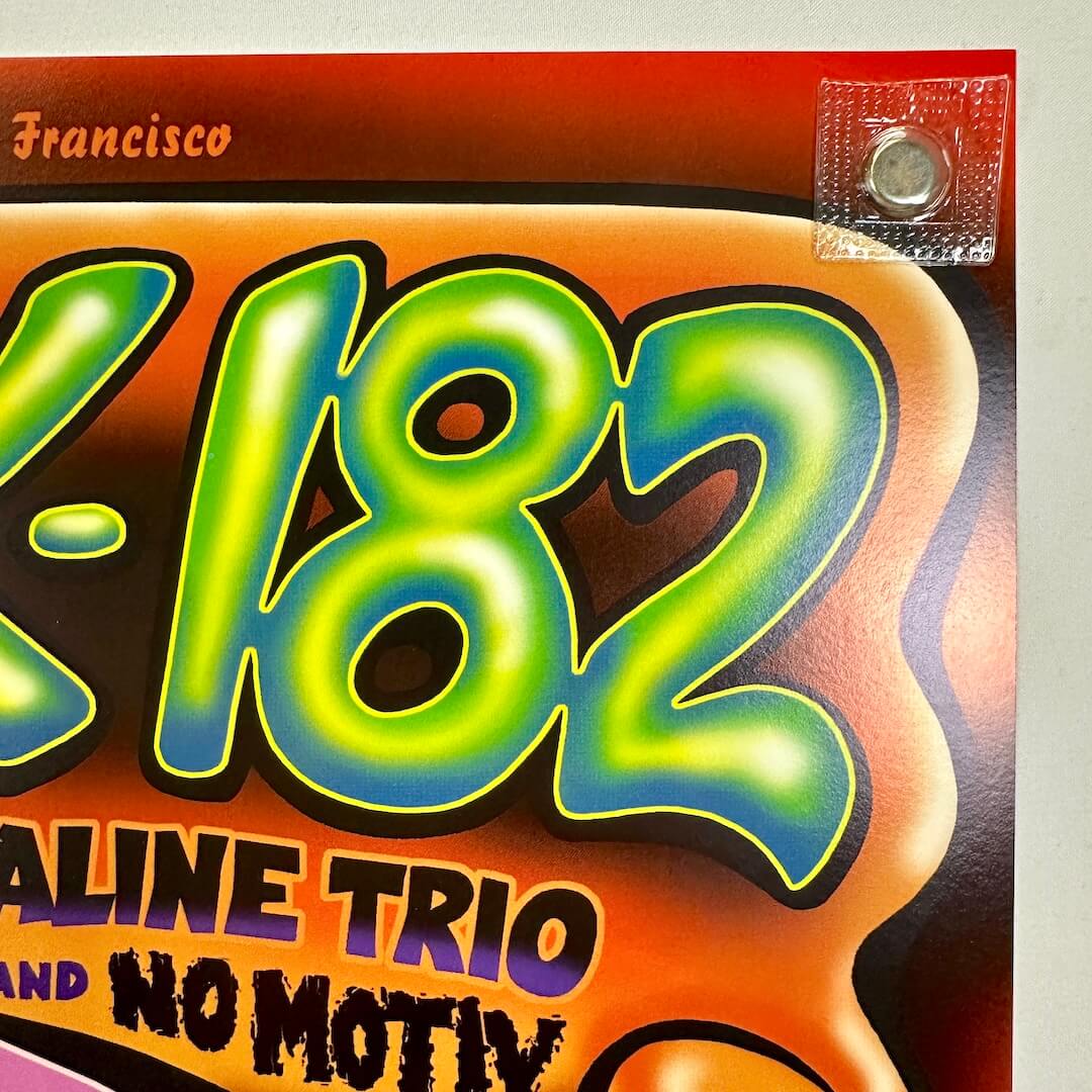 Top right corner of poster with crisp corner and clean edges.