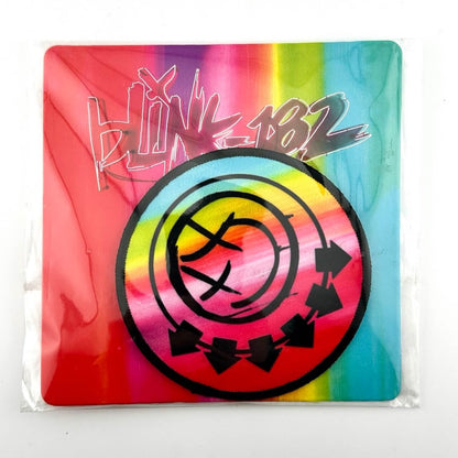 Rainbow card with "blink-182" in neon lettering outline, rainbow patch with black blink-182 logo.