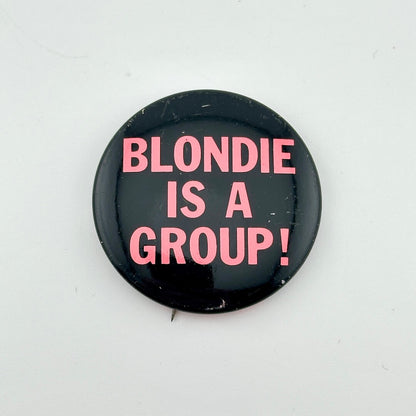 Button badge with 'BLONDIE IS A GROUP!' text on a white background
