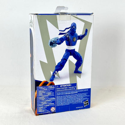 Back of packaging with image of posed toy and warning information. 