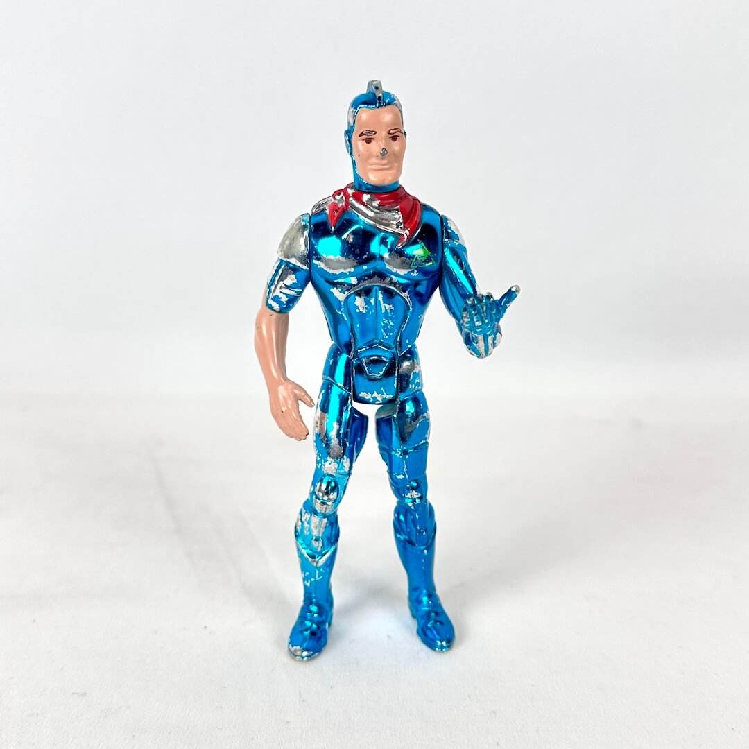 A metallic blue action figure of a superhero character with a red bandana around neck, and one human arm. 