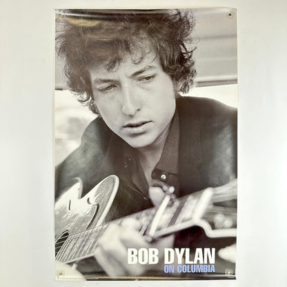 Black and white poster of Bob Dylan playing guitar with text 'Bob Dylan on Columbia'.