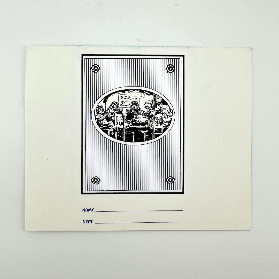 Backside of pass with black and white illustration of people around a table on a light gray background