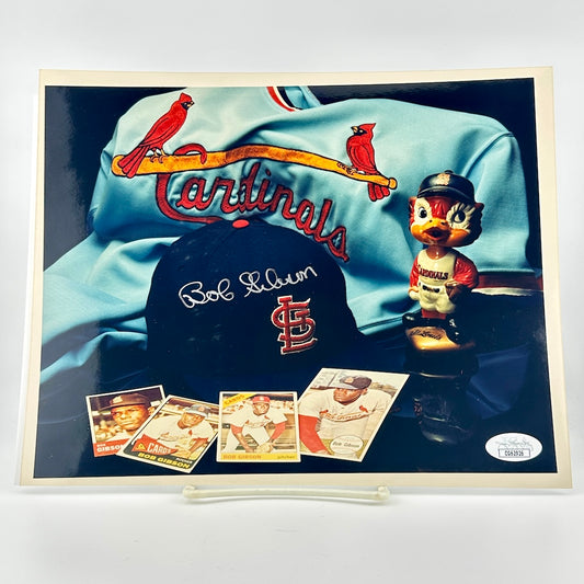 Photograph of memorabilia collage featuring signature of player, JSA authentication sticker in corner. 