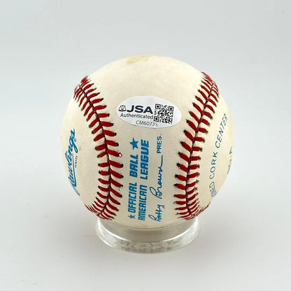 Baseball with red stitching on a white background