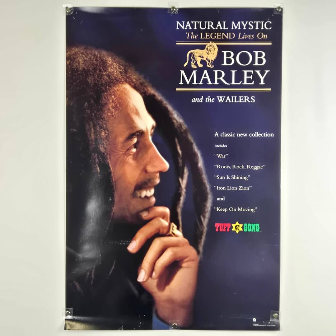 Poster of Bob Marley with text about his music collection on a blue background