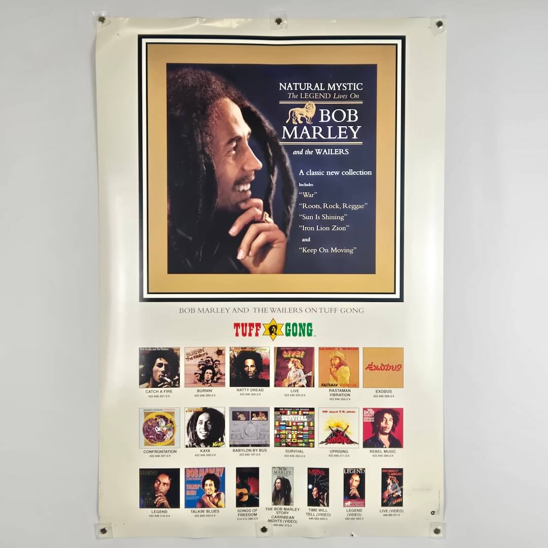 Poster of Bob Marley and The Wailers with album cover images on a gray background