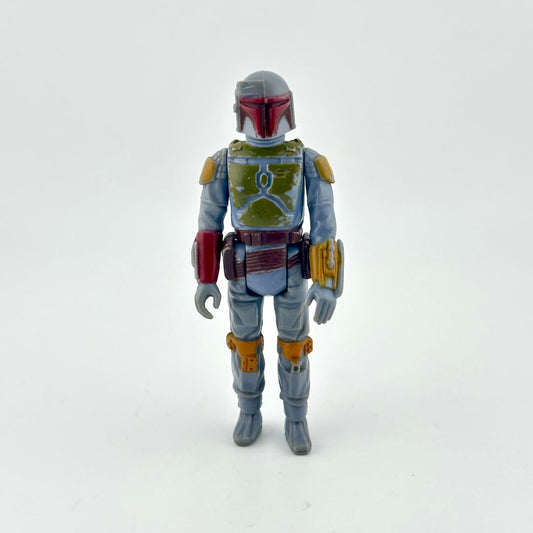 Action figure with a gray and green costume on a white background