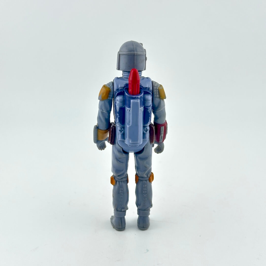Toy figure with a gray helmet and blue suit on a white background