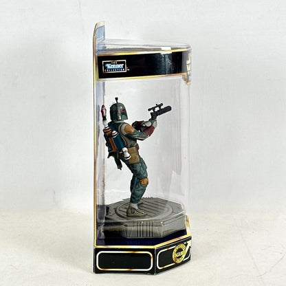 Boba Fett figurine in a transparent display case with Kenner branding on a white background