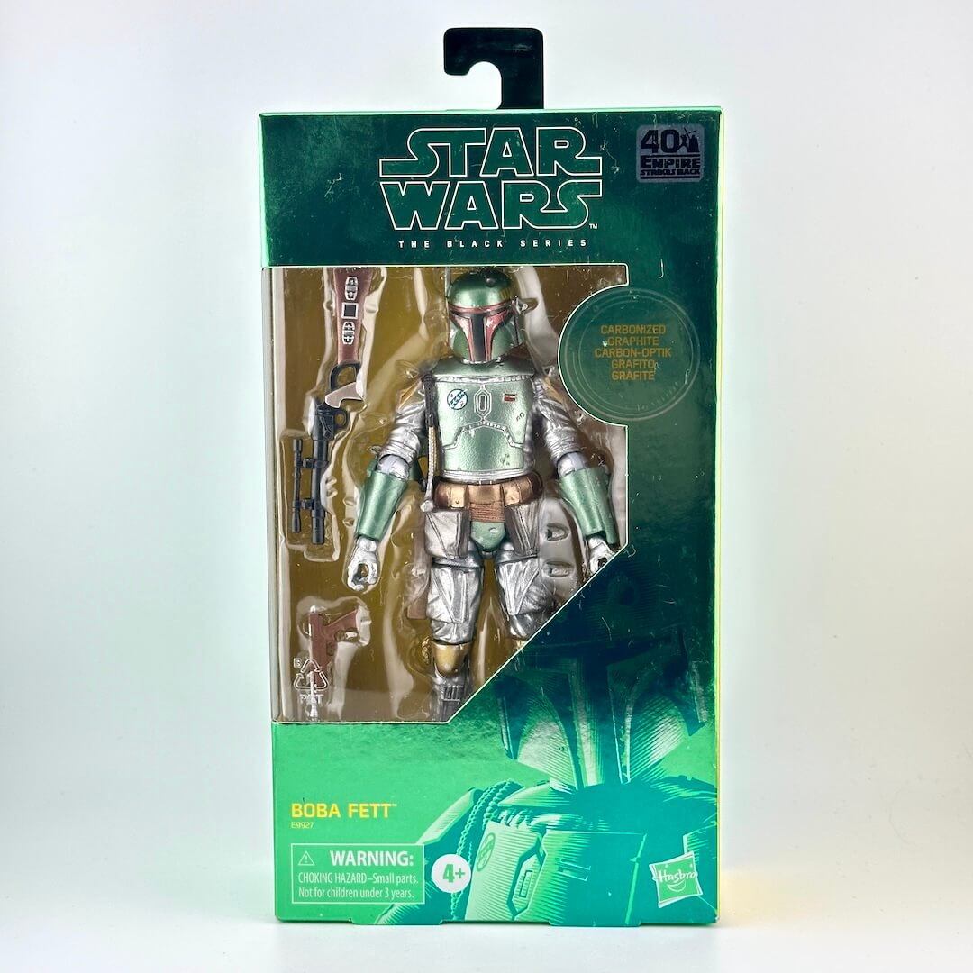 Star Wars The Black Series Boba Fett action figure in its original green and black packaging, featuring a clear window.