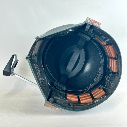 Interior view of helmet to show adjustable strap and cushions for comfort. 