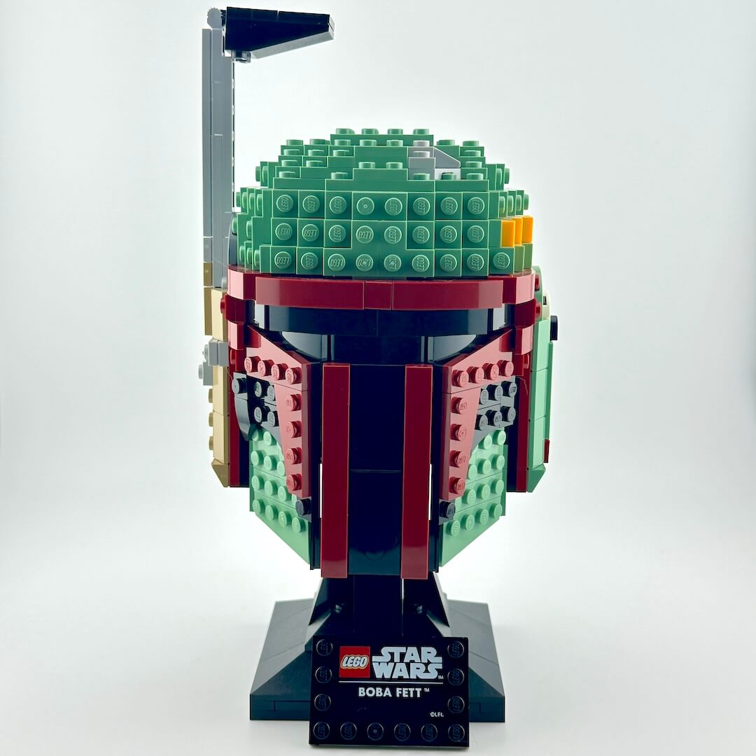 Assembled Lego bust of Boba Fett against white background, front view.
