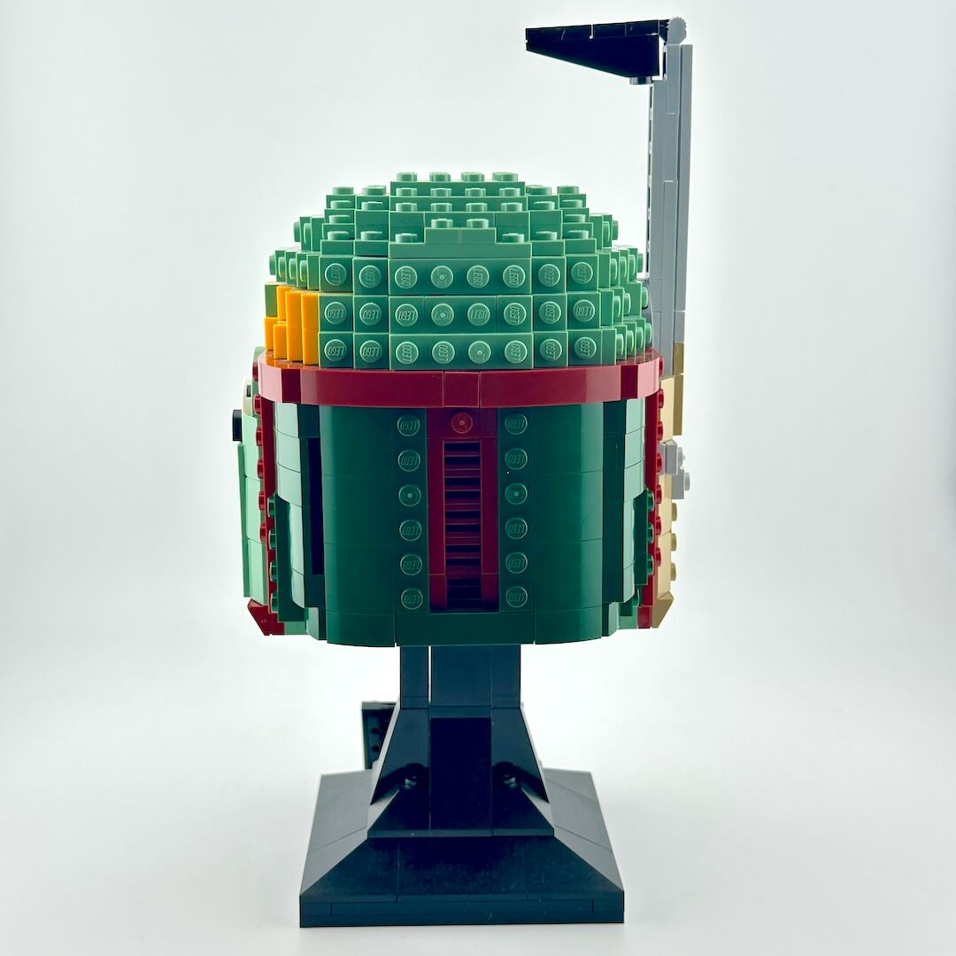 Assembled Lego bust of Boba Fett against white background, reverse view.
