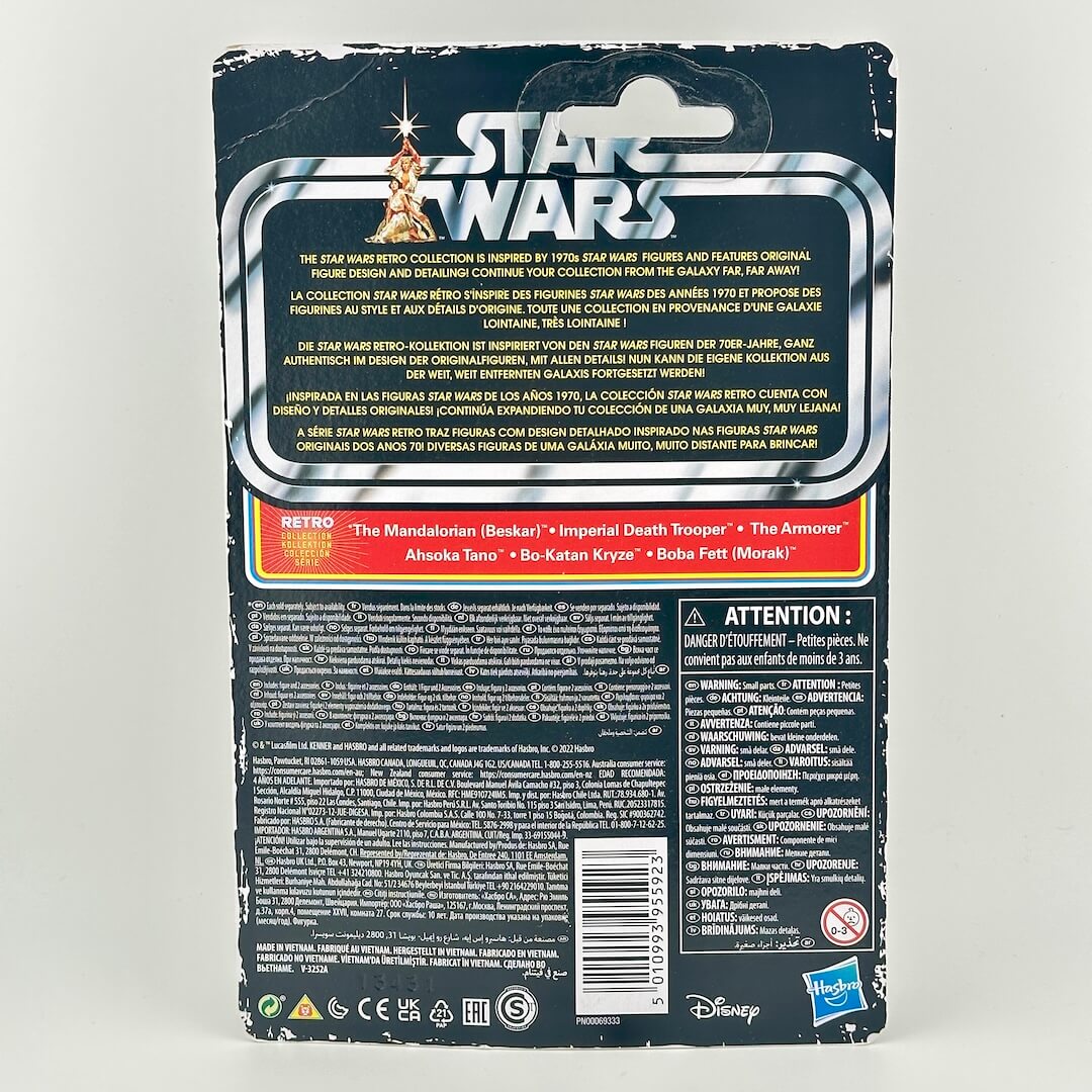 Back of a Star Wars toy packaging card, showing product details, descriptions in multiple languages, & warning labels.