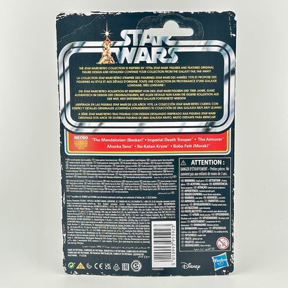 Back of a Star Wars toy packaging card, showing product details, descriptions in multiple languages, & warning labels.