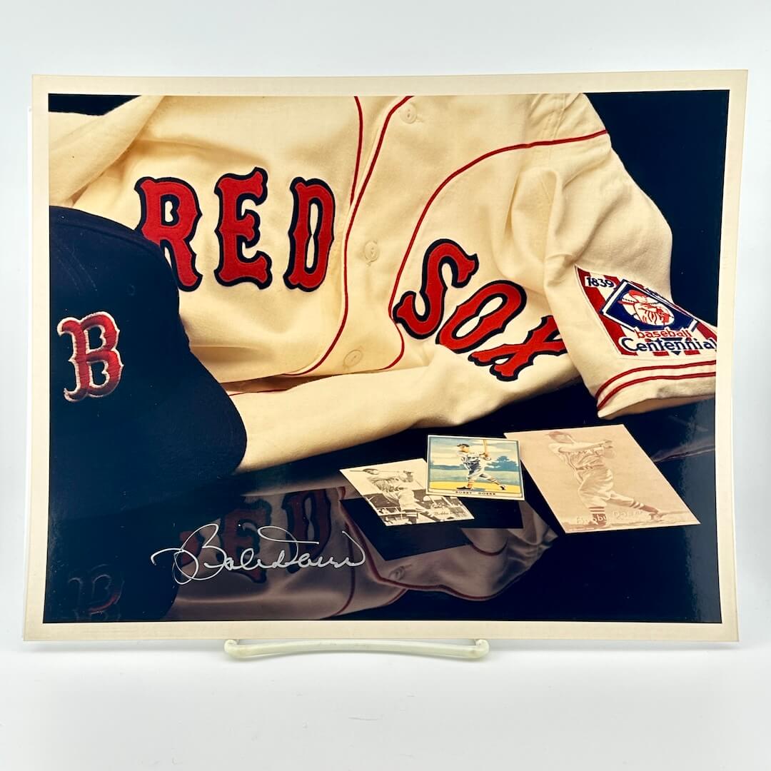 Photo of arranged baseball memorabilia featuring Bobby Doerr and his signature. 