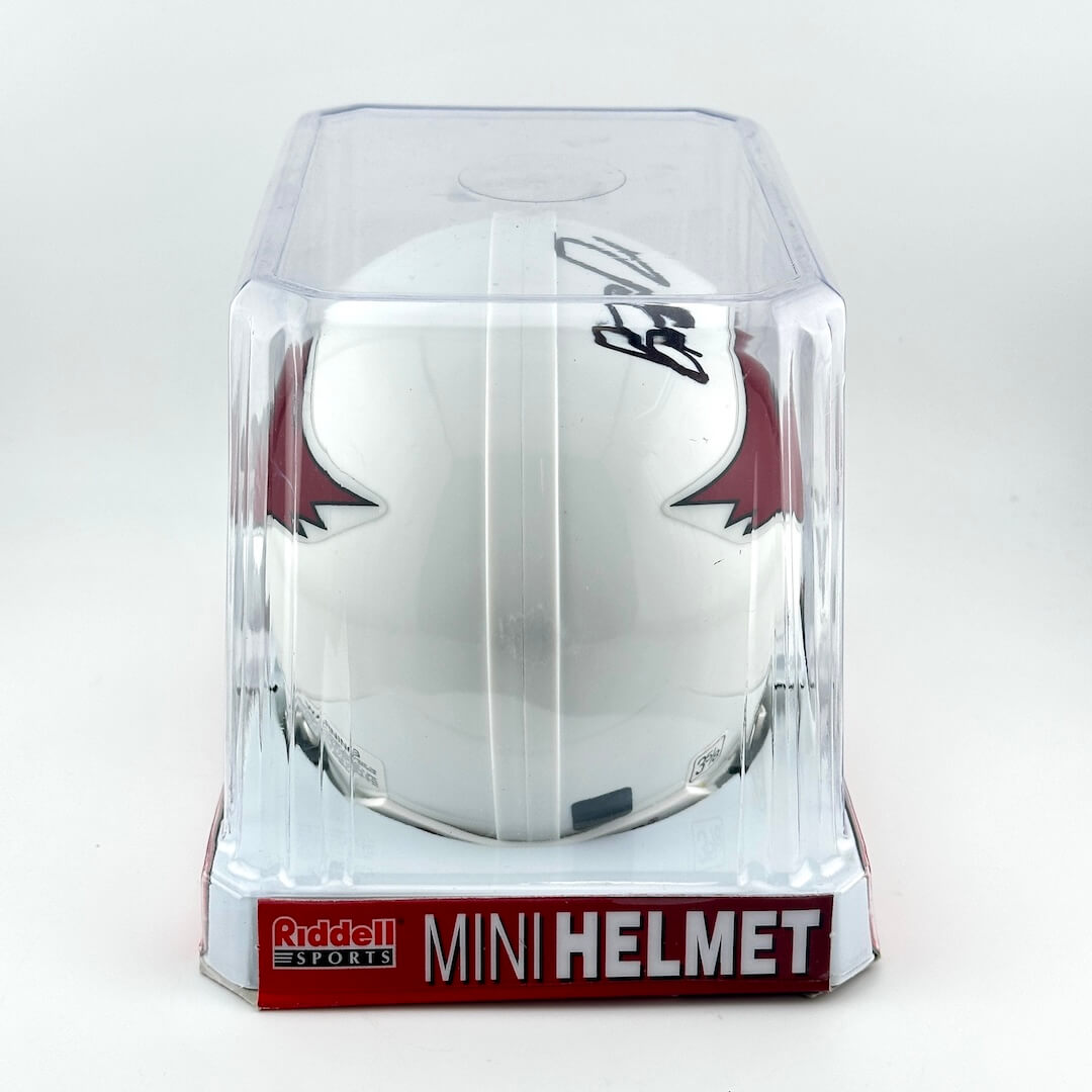 White mini football helmet with red accents in clear packaging on a white background