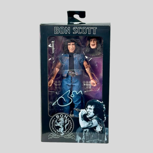Action figure packaging of a musician with a guitar, featuring branding and graphics on a white background.