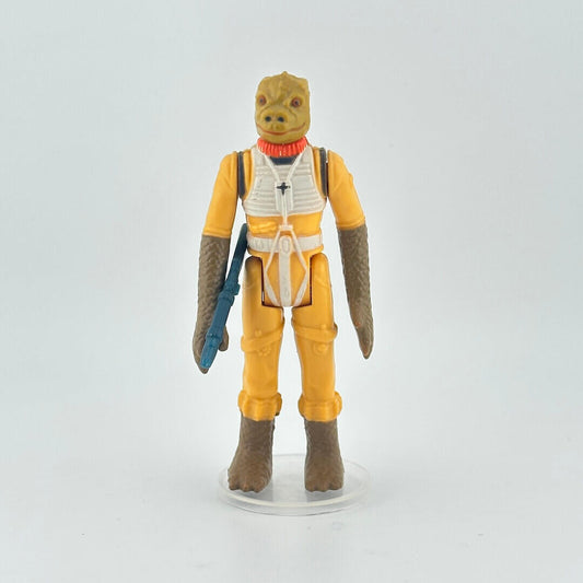 Action figure in yellow outfit with a blue weapon on a white background