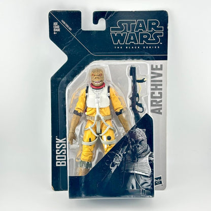 Star Wars Black Series Archive Bossk figure in original window packaging, showing figure and accessories. 
