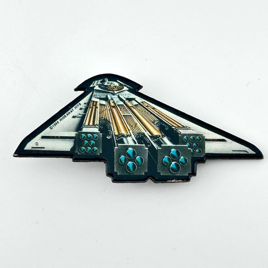 Vintage pin shaped like a spaceship against white background.