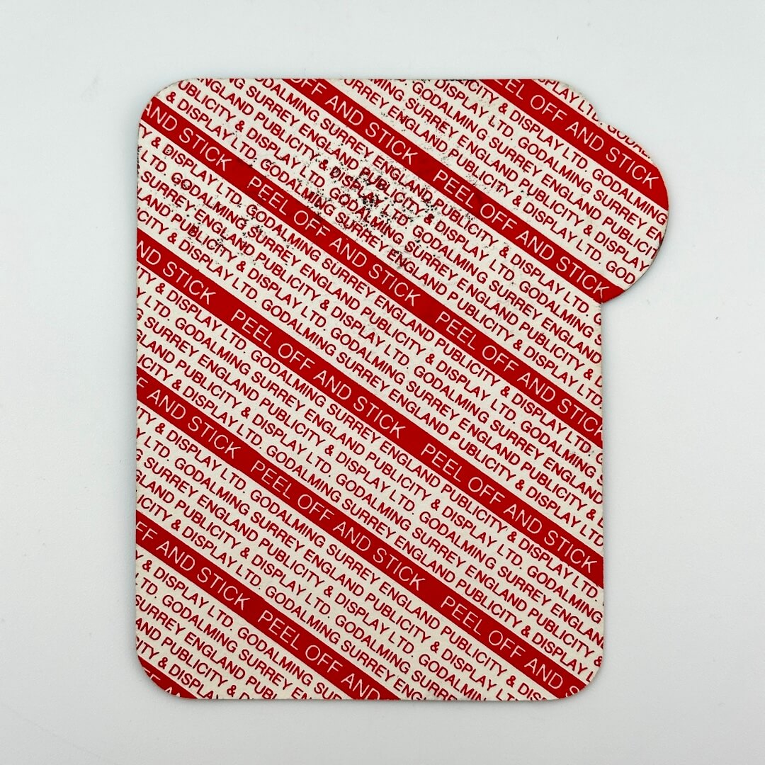Backside of pass to show unused adhesive backing. 
