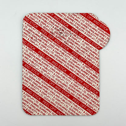 Backside of pass to show unused adhesive backing. 