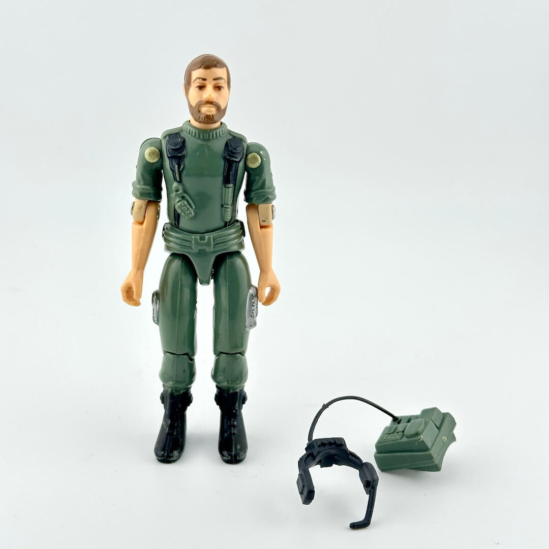 Action figure in green military suit with accessories on a white background