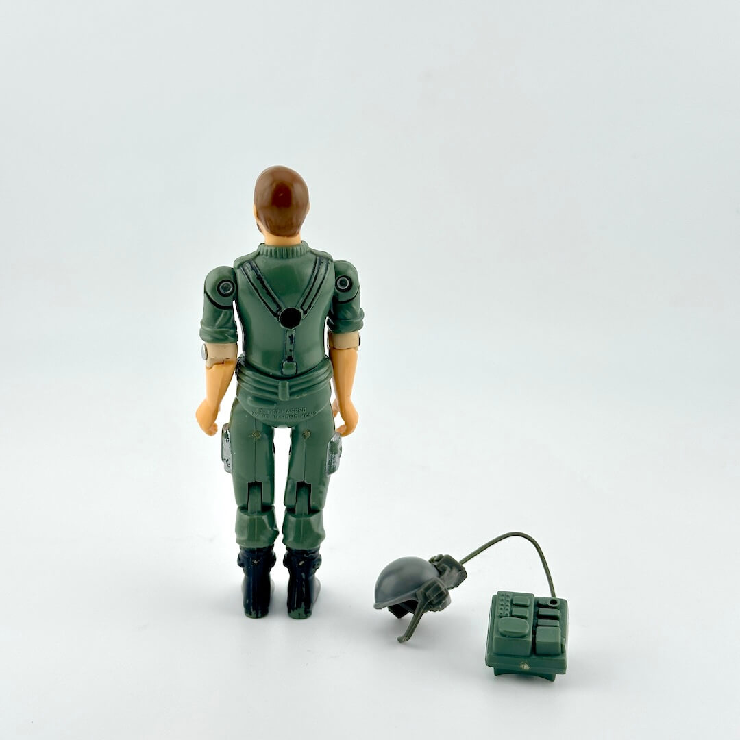 GI Joe action figure with accessories against white background. 