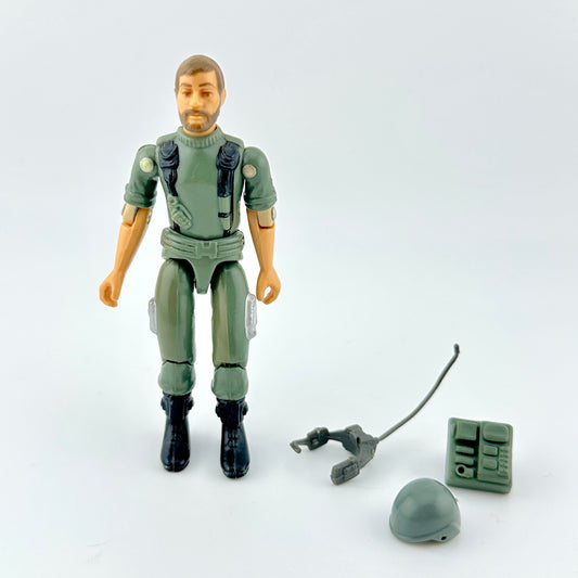 GI Joe action figure with accessories against white background. 