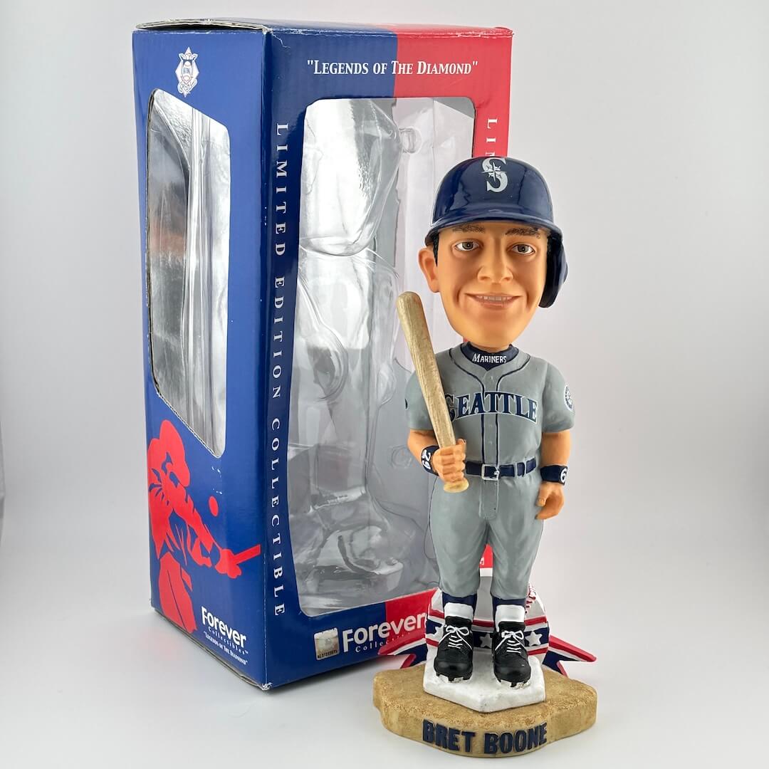 Baseball bobblehead figure with bat in front of packaging labeled 'Legends of the Diamond'.