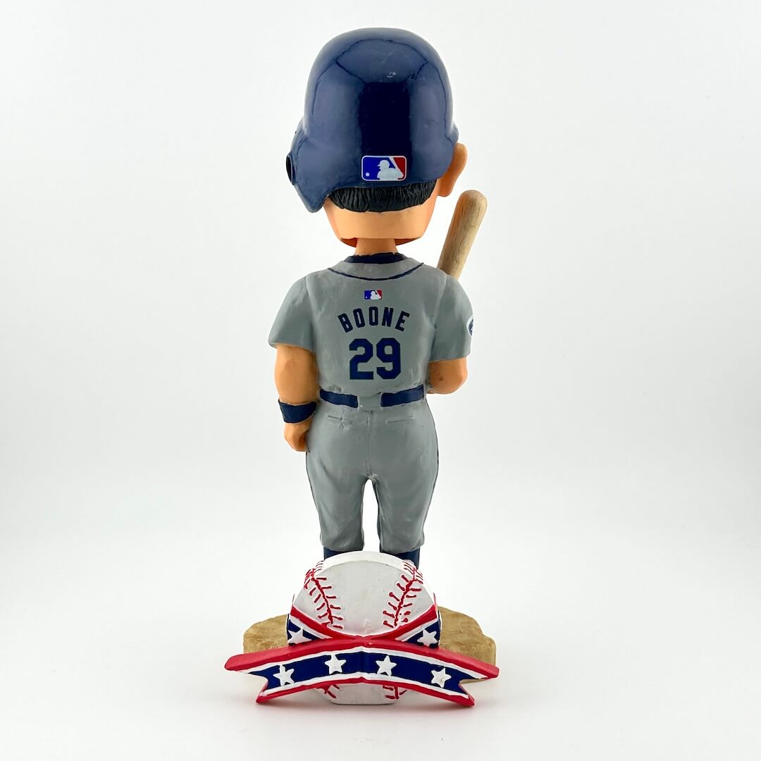 Baseball bobblehead figure with helmet, bat, and uniform on a white background