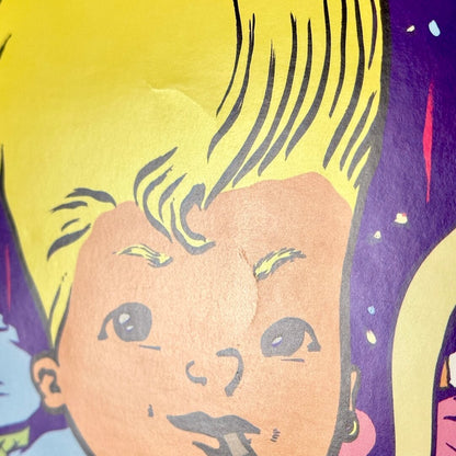 Side view of slight creases in center of poster. 