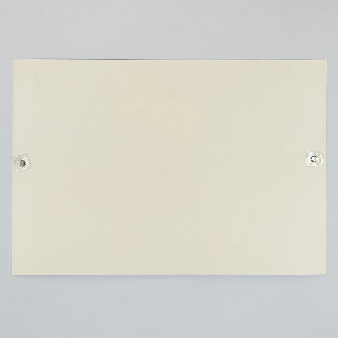 Backside of white poster against white background. 