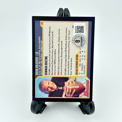 Football card with player image and text on a stand against a white background
