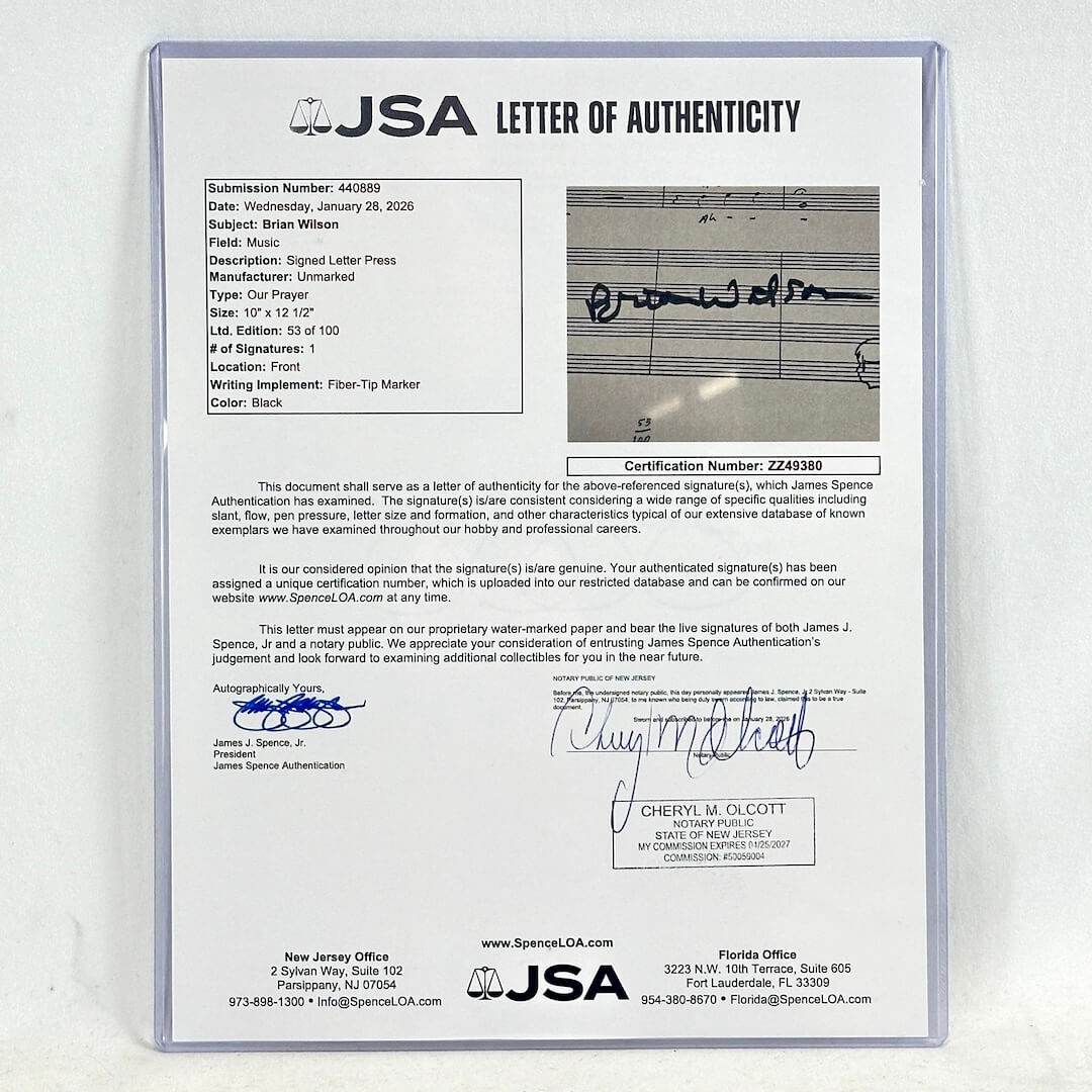 A JSA Letter of Authenticity document sealed in a clear plastic protective sleeve, featuring printed text, signatures, and authentication details.