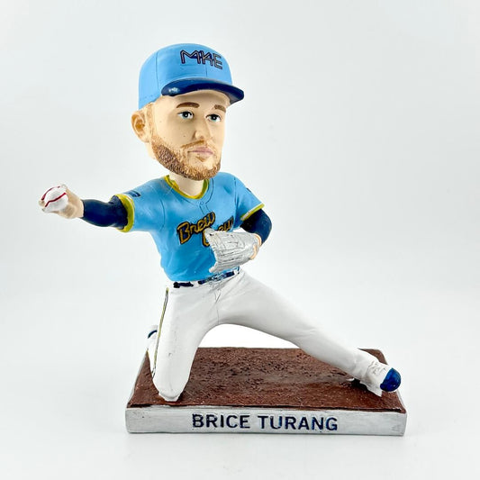 Bobblehead of a baseball player in a blue uniform with 'Brewers' on the cap, on a white background.