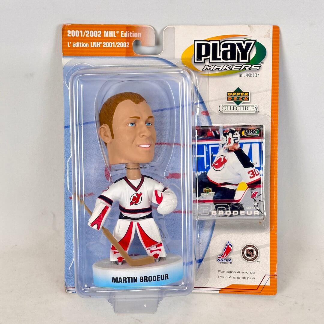 Hockey bobblehead figure in packaging with branding and player details.