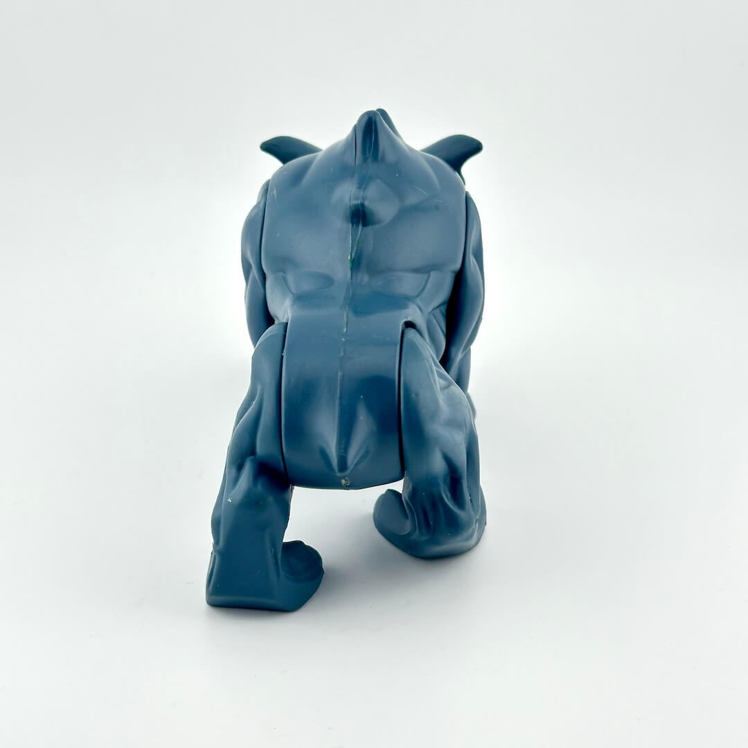 Action figure of blue dog-like creature. 