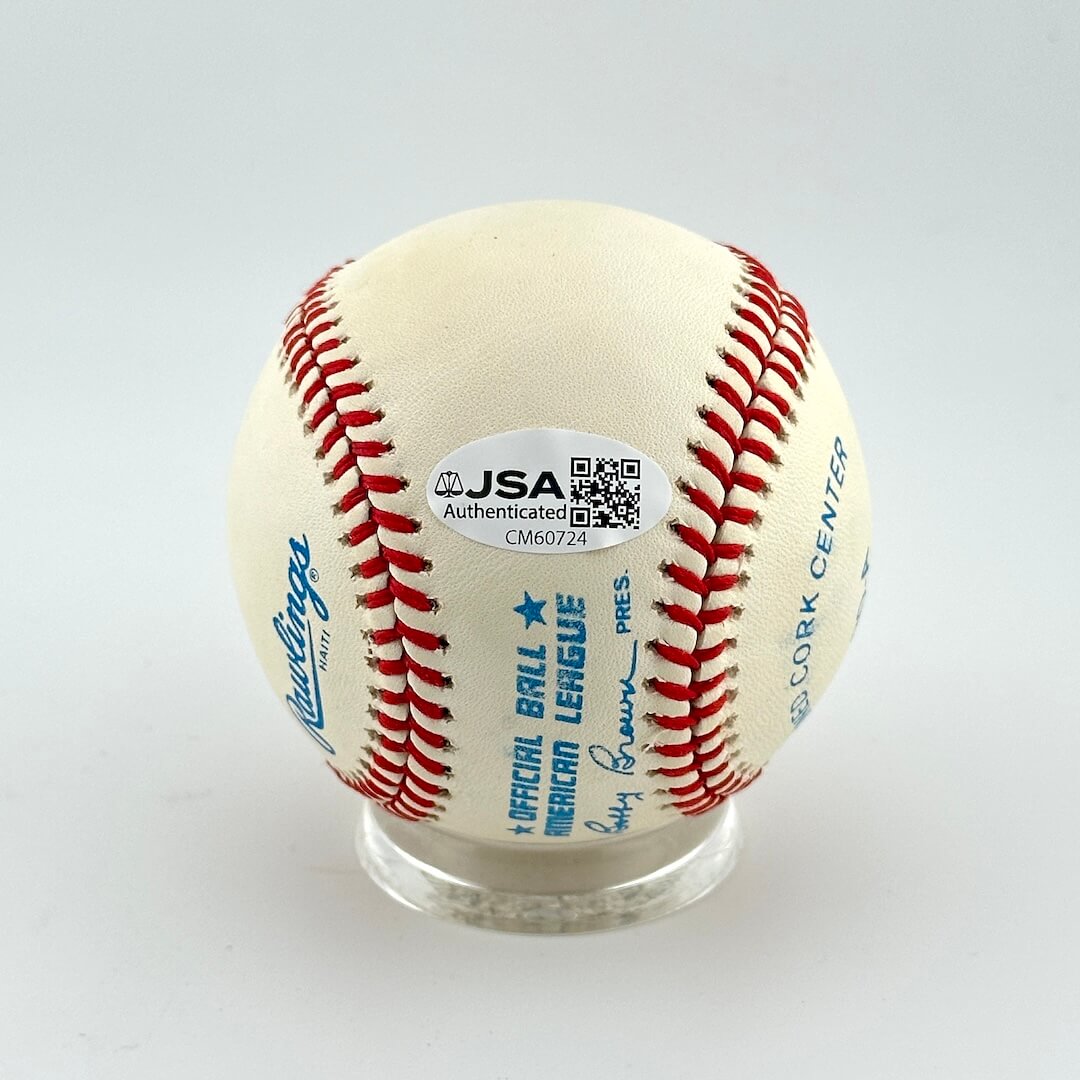 Baseball with JSA authentication label on a white background