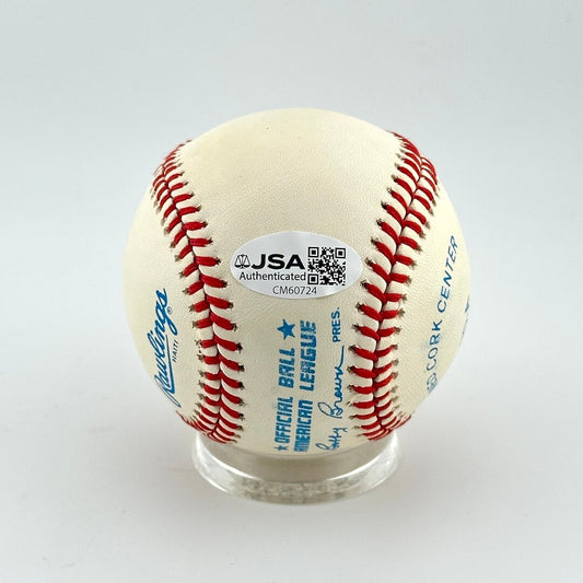 Baseball with JSA authentication label on a white background