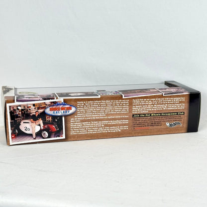 A boxed model car set package shown from the back, with printed text, & a small photo of a person in a race car.